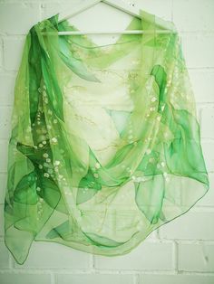 Glamourous Hand painted silk chiffon scarf - Lilies of The Valley in green. Beautiful wild flowers lovely laid out through all length long. This design Scarf is MADE TO ORDER and available in 2 SQUARE and 5 OBLONG sizes (with butterflies or without): 21*x21 inches (55x55cm)- Very small square. Can serve as a kerchief; wrist, head or bag band. 35*35 inches (90*90cm) -Possible various combinations of twisting on neck/chest. XS---59x15 inches (150x40 cm)- quite Small scarf. This size is good who li Elegant Green Scarves For Spring, Spring Party Green Dupatta, Elegant Green Summer Scarves, Elegant Green Scarves For Summer, Green Dupatta For Wedding In Spring, Elegant Green Floral Silk Scarf, Elegant Green Floral Print Silk Scarf, Spring Wedding Silk Shawl, Summer Floral Print Green Dupatta