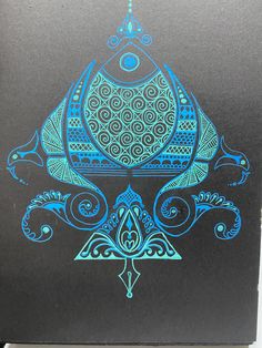 a black book with blue designs on it