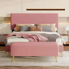 a bed with pink upholstered headboard and foot board in a bedroom setting