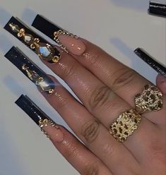 Black Snd Gold Acrylic Nails, Black Nails Inspiration Long, Black Long Nails With Rhinestones, Black Nails With Gold Gems, Black And Gold Nails Prom, Black And Gold Quince Nails, Black Quince Nails