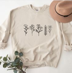 "PLEASE READ ENTIRE DESCRIPTION BEFORE PURCHASING Botanical sweatshirt, Plant lover Shirt, Plant Shirts, Gardening Sweatshirts, Flower Shirt, Gift for her, Floral Sweatshirts Fall in love with this soft and cozy Graphic Tee, Sweatshirt or hoodie  TO MAKE YOUR SHOPPING EXPERIENCE EASIER, YOU CAN \"CHOOSE\" A T SHIRT, SWEATSHIRT OR HOODIE IN THIS LISTING. Available in Shirt, Sweatshirt and Hoodie Tee Shirt Shirt Sleeve Crewneck Unisex 100% Cotton Sweatshirt and Hoodies Long Sleeve Soft 50/50 blend Casual Long Sleeve Tops With Plant Print, Casual Long Sleeve T-shirt With Plant Print, Spring Crew Neck Sweatshirt With Plant Print, Spring Plants Print Long Sleeve Sweatshirt, Long Sleeve T-shirt With Plants Print For Spring, Botanical Long Sleeve Tops With Plant Print, Spring Long Sleeve Botanical Sweatshirt, Fall Cotton Sweatshirt With Plant Print, Fall Casual Sweatshirt With Plant Print