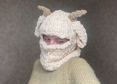 a woman wearing a knitted hat with horns