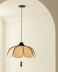 a light fixture hanging from the ceiling in a room