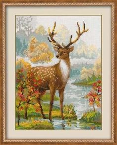 a cross stitch picture of a deer by the water