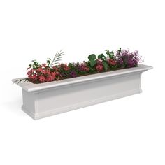 a white planter filled with lots of flowers