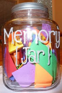 there is a glass jar with many different colored papers in it that says memory jar