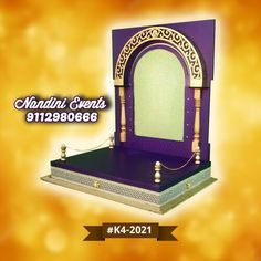 an ornate purple and gold mirror on top of a wooden stand with the words mardi gras written below it