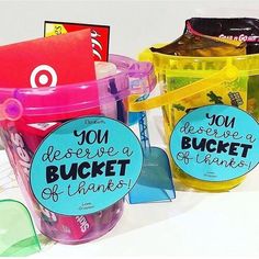 two buckets filled with different types of thank you notes and some plastic cups that say you have a bucket of thanks