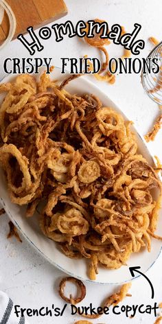 crispy fried onions on a white plate with the words homemade crispy fried onions