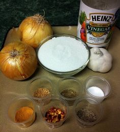 an assortment of spices and seasonings on a counter top with garlic, onions, peppercorst, onion oil, salt, and other ingredients