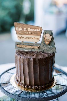 a chocolate cake sitting on top of a metal rack