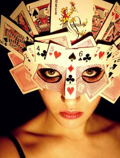 a woman with playing cards on her head