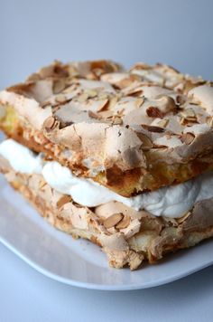 two pieces of dessert sitting on top of a white plate