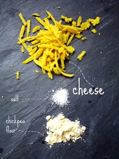 the ingredients for cheese are shown on a slate board