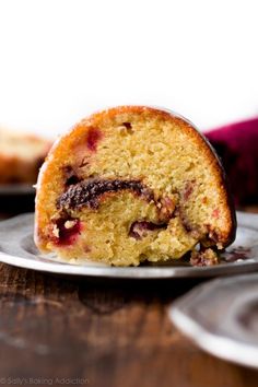 a slice of cranberry orange bundt cake on a plate