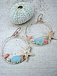 "These hoops are like a walk on the beach! A beachcomber's or treasure hunter's dream! Fit for a mermaid or any girl filled with wanderlust... These 14k Gold-Filled hoops feature REAL starfish, bits of aqua glass and peach coral, and blushy-peach freshwater pearls, that have been woven along the inside edge. The rich colors and beachy-mix add to the allure of these hoops. You will be sure to get a million compliments on your Handmade In Hawaii Hoops... NOTE: Although almost all of my items featu Bohemian Pink Jewelry For Beach Party, Handmade Pink Jewelry For Beach Party, Handmade Summer Jewelry For Beach Wedding, Pink Jewelry For Beach Party, Pink Jewelry For Beach Party Season, Ocean-inspired Dangle Hoop Earrings For Beach, Beachy Jewelry With Starfish Charm For Beach, Pink Beach Jewelry For Beach Season, Ocean-inspired Jewelry For Beach Party