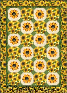 a quilt with sunflowers on it in the middle of a green and white background