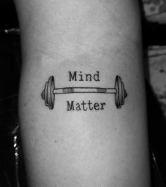 a black and white photo of a barbell with the words mind matter on it