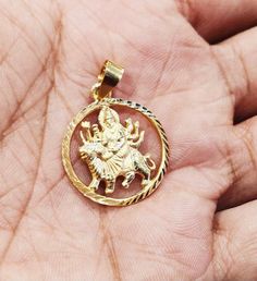 22k Gold Goddess Durga Pendant, Vaishno devi Pendant In Gold, Indian Goddess Gold Pendant, Solid Gold Pendant,Mata Rani Pendant This is beautifully handmade designed Indian Solid 22k Hallmarked gold goddess Durga Pendant, beautifully made Durga Ma pendant. She is worshipped as a principal aspect of the mother goddess Devi and is one of the most popular and widely revered among Indian divinities. She is associated with protection, strength, motherhood and destruction. Metal: 22k Gold Size: 22mm r Temple Necklace For Puja And Navratri, Round Necklace For Navratri Puja, Heavy Temple Necklace For Navratri Puja, Temple Necklace For Puja And Diwali, Temple Necklace For Diwali Puja, Navratri Necklaces With Zari Work, Diwali Puja Temple Necklace With Round Shape, Navratri Temple Necklace Chandbali For Puja, Round Temple Necklace For Diwali Puja