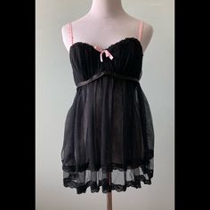 Sheer Black Baby Doll With Double Tulle Skirt Front, Lace Trim. Back Single Tulle Skirt. Shirred Bodice Has Lightly Padded, Underwire Cups, Pink Ribbon Straps In Front, Adjustable In Back. Back Hook & Eye Closure With Pink Ribbon Detail. Sz L. Fits C-D Cups. Unworn Babydoll Goth, Black Coquette Nightgown For Sleep, Black Lace Trim Sleepwear For Bedtime, Black Lace Trim Cami Sleepwear, Black Babydoll, Black Baby Dolls, Black Babies, Pink Ribbon, Women's Intimates