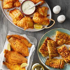 some fried food is on a plate and next to an egg yogurt sauce