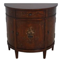 an ornately decorated wooden cabinet with drawers