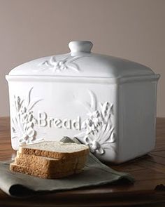 two pieces of bread sitting on top of a cutting board