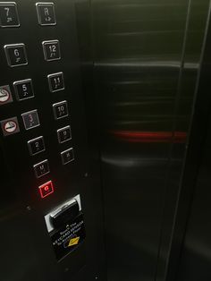 an elevator with buttons and numbers on it