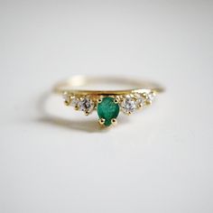 A lustrous pear shape emerald is set with a row of shiny CZs. This ring reminds us of somewhere royal. Handcrafted in 14K solid gold. Materials: - 14K solid gold - Natural 0.20ct pear shape emerald. 4*3mm - Top 5A grade CZ This item is specially made for you. Please allow 1-2 week lead time. Online Return Policy: Due to the made-to-order nature of our jewelry. All products are final sale. Please email us if you are unsure. Gold Oval Engagement Ring, Rose Gold Oval Engagement Ring, Punk Rock Jewelry, Hammered Gold Ring, Moissanite Engagement Ring Rose Gold, Diamond Wedding Rings Sets, Oval Engagement, Ruby Engagement Ring, Rose Engagement Ring