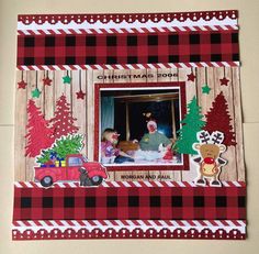 a christmas card with an image of a man and his daughter in the window, surrounded by holiday decorations