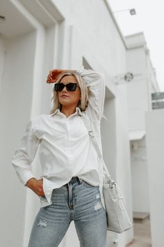 The styling possibilities are endless with the "Good Karma" button-down top! This classic white top features a woven fabric and collared neckline. Styled with the It is the definition of a year round closet staple. Model is in a size small Casual Layering Piece Fall Blouses Lightweight Button Down Patterns May Vary Colors May Vary Round Closet, Fall Blouses, Fall Blouse, Good Karma, Button Up Long Sleeve, Closet Staples, Work Week, Layering Pieces, White Top