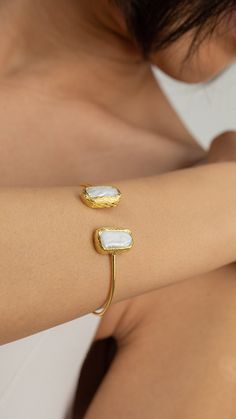 The appeal of a Dainty gold watch band lies in its subtlety. Despite its slim and discreet look, it has a profound impact. Thanks to its minimalist design, the bracelet complements a wide range of outfits, from casual to formal. This makes it a versatile accessory suitable for a variety of occasions. It's a unique holiday gift. Material: Hight Quality Brass and Pearl Finish: 22K Gold Filled How To Order You can make your choice from the drop-down menu. The bracelet is available in our stock. For more Options https://www.etsy.com/shop/Flechazojewelry Information The product will be sent in an elegant gift box. Box and packaging are recyclable. If you want to get information or advice about our products, please contact us. We are waiting 💃 Thanks for your visiting and shopping. Dainty Gold Watch, Gold Watch Band, Pearl Charm Bracelet, Pearl Jewelry Wedding, Snake Chain Bracelets, Jewelry Bridesmaid, Baroque Pearl Necklace, Unique Holiday Gifts, New Mom Gift