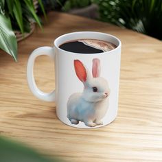 a coffee mug with a rabbit on it