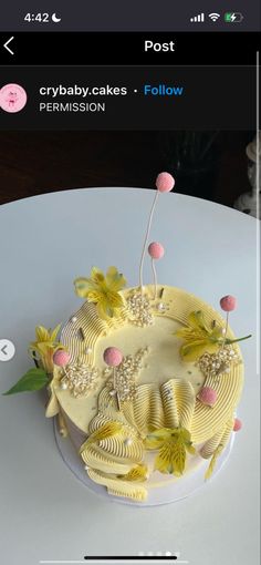 a white cake with yellow flowers on it