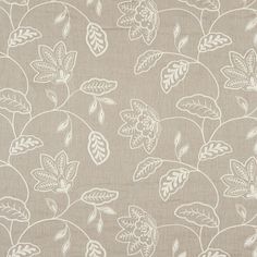 a beige and white fabric with leaves on it