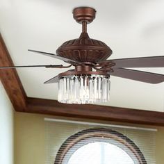 a ceiling fan with crystal chandelier hanging from it