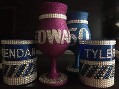 three wine glasses are decorated with swaro beads and sequins, one is purple the other is blue