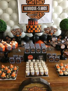 a motorcycle themed birthday party with cupcakes and desserts