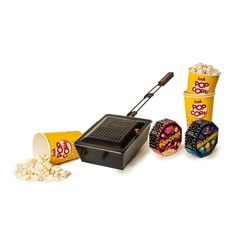 the popcorn popper is next to two buckets of popcorn and some other items