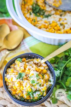 two bowls filled with rice and vegetables on top of a woven table cloth next to spoons