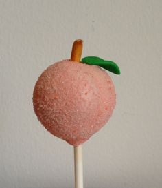 a close up of a candy apple on a stick