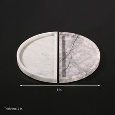 a white marble tray with two sections cut out to show the size and length for each plate