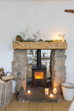 a fire place with candles in front of it