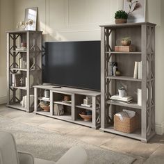 a large tv stand with shelves and baskets on the floor for $ 53 per week