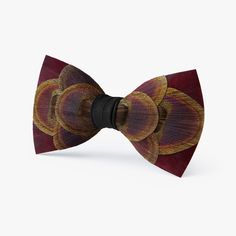 Deep, rich shades of burgundy off set the natural iridescence of the peacock eye on this beautiful bow tie. Perfect for black tie affairs, this will surely set you apart from the crowd. Elegant Brown Bow For Party, Feather Bow Tie Wedding, Black Butterfly Knot Bow Tie For Wedding, Elegant Brown Bow Tie, Luxury Semi-formal Bow Ties, Feather Bow Ties, Burgundy Bow Tie, Classic Pre-tied Butterfly Knot Bow Tie, Shades Of Burgundy