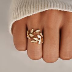 Add a touch of luxury to your everyday look with this beautiful ring. Delicate, elegant, and perfect for any occasion. 18K gold plated, Stainless steel Adjustable - fits ring size US 5-7 or 8-10 Hypoallergenic, lead & nickel free US/Canada Ring Size UK/AU Ring Size Inside Diameter (mm) 5 J 15.7mm 6 L 16.6mm 7 N 17.2mm 8 P 18.1mm 9 R 19.1mm 10 T 19.7mm If you aren't in LOVE with your purchase, please let us know within 30 days of receiving your item, and you'll receive a stress-free refund. Casual Rings Women, Pretty Rings Gold, Gold Rings Women, Jewellery Elegant, Gold Leaf Ring, Gold Leaf Rings, Ring Accessories, Gold Flower Ring, Casual Rings