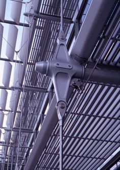 the ceiling is covered with metal bars and wires, as if they were hanging from it's sides