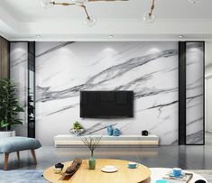 a modern living room with marble walls and flooring, furniture and accessories on the coffee table