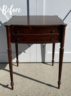 a small wooden table sitting in front of a white wall with the words before written on it