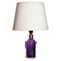 Vintage Orrefors Table Lamp, 1960s This elegant table lamp by Orrefors, crafted in the 1960s, features a striking combination of purple and clear glass. The base showcases a vibrant purple glass core encased in clear glass with artistic wave-like details. Topped with a brass fitting, this lamp exudes mid-century modern charm. Please note, the lampshade is not included. The lamp is in excellent vintage condition, adding a touch of color and sophistication to any room. Elegant Table Lamp, Table Vintage, Vibrant Purple, Brass Fittings, Brass Glass, Purple Glass, The 1960s, Elegant Table, Table Lamp Lighting